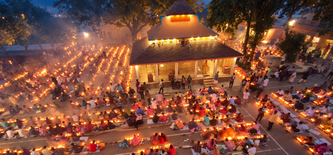 Temple, people and rows of lamps, while adding a dreamy blue-hour atmosphere, warm golden glow, gentle mist and improved clarity. Rash Mela is a major annual traditional and religious festival celebrated during the full moon (Rash Purnima) in November across parts of Bangladesh